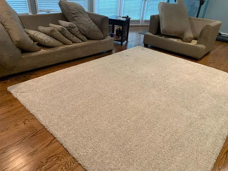 Wool area rug prepared for cleaning at a Longport oceanfront home